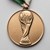 An Italia 1990 3rd/4th Place bronze medal