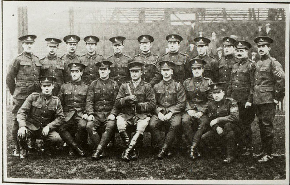 Soldiers in uniform at a football ground